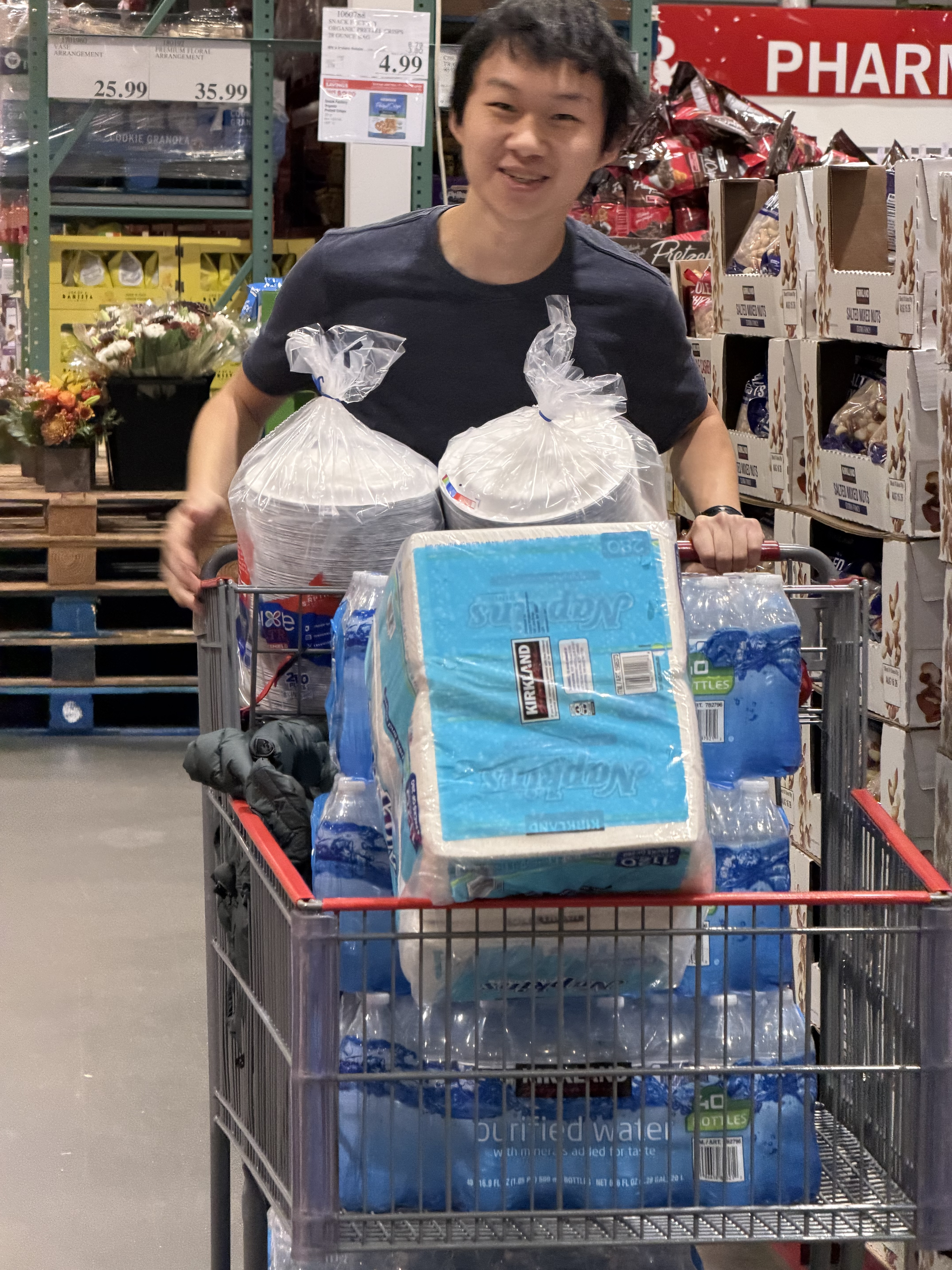 George behind a Costco cart smiling