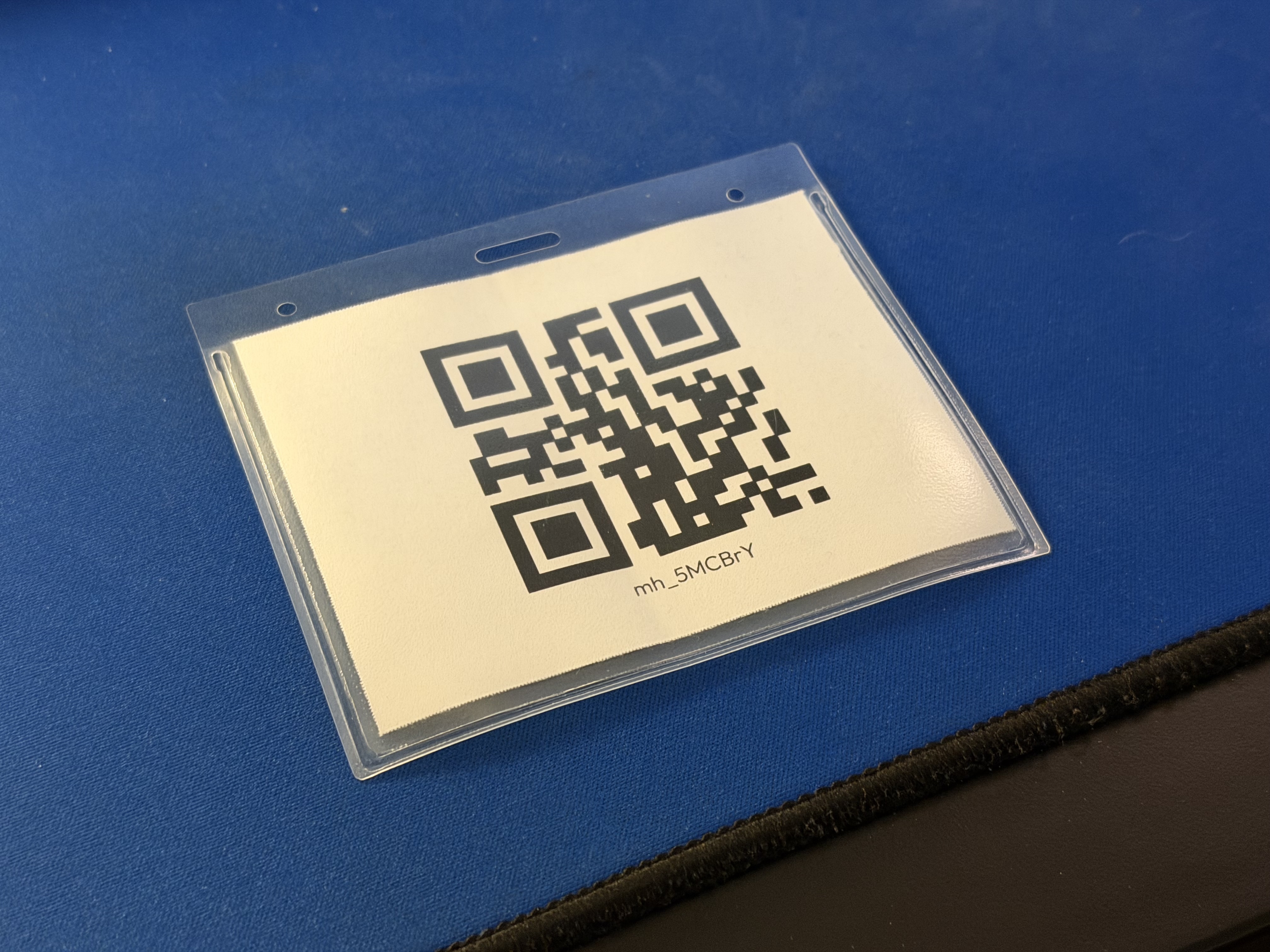 Back side of a name tag with a QR code
