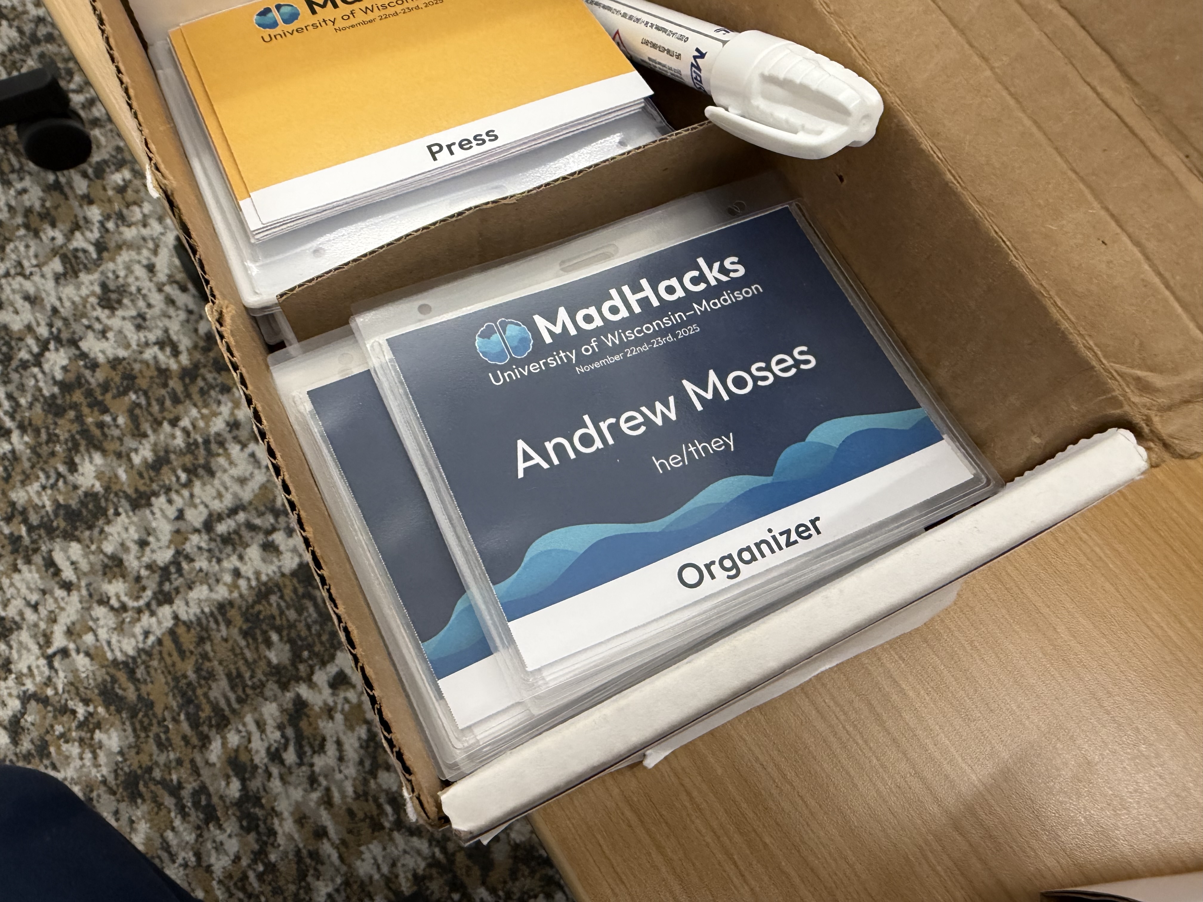 A box full of individually separated name tags